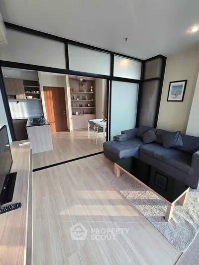 Modern living room with open layout and stylish furniture in a contemporary apartment.