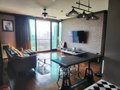 Spacious living room with city view, featuring modern decor and large windows for natural light.