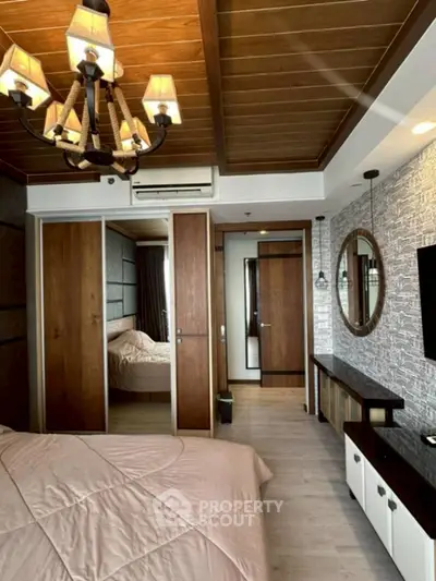 Elegant bedroom with wooden ceiling and modern decor, featuring a cozy bed and stylish lighting.