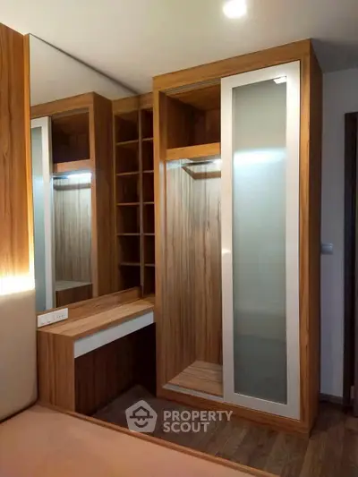 Modern wooden walk-in closet with sleek design and ample storage space