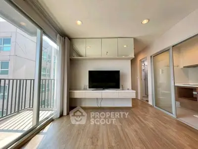Modern living room with large windows and balcony access
