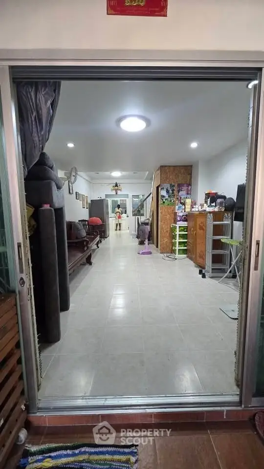 Spacious living area with modern decor and ample natural light