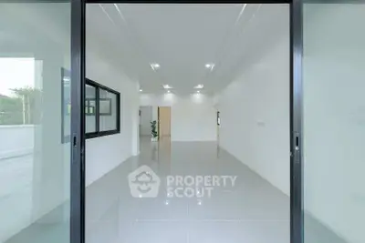 Spacious modern interior with sleek tile flooring and large windows