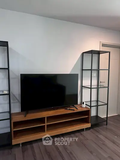 Modern living room with sleek TV stand and minimalist shelving