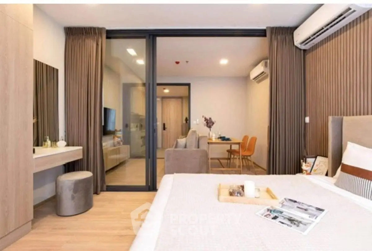 Modern bedroom with stylish decor and open view to living area