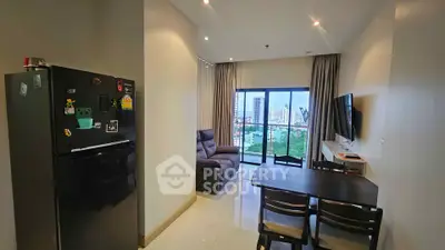 Modern living room with city view, featuring sleek furniture and a cozy atmosphere.