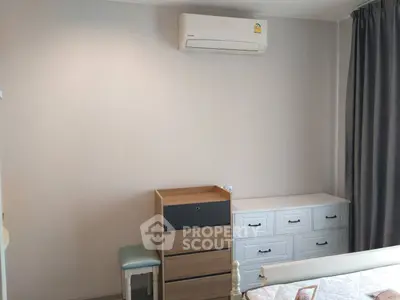 Cozy bedroom with air conditioning and modern furniture