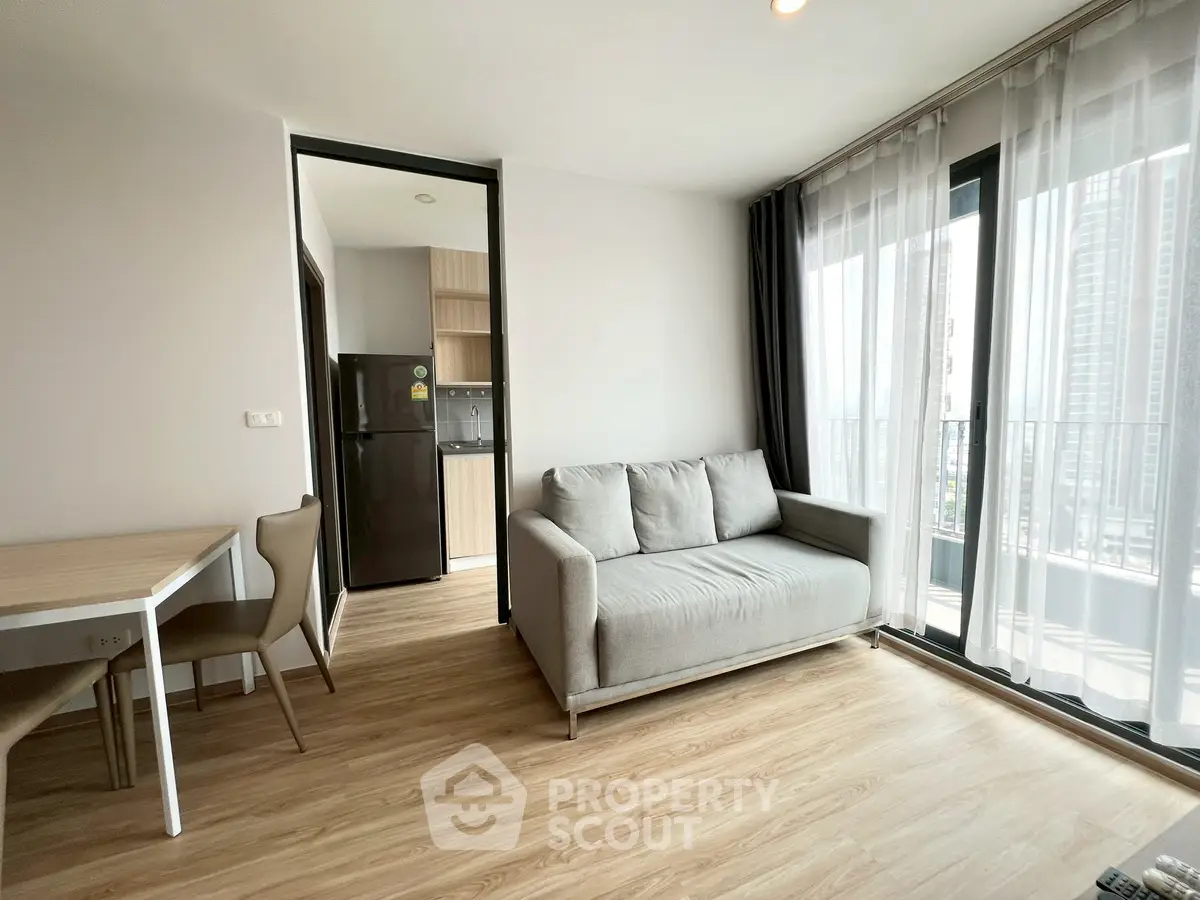 Modern living room with balcony view in high-rise apartment