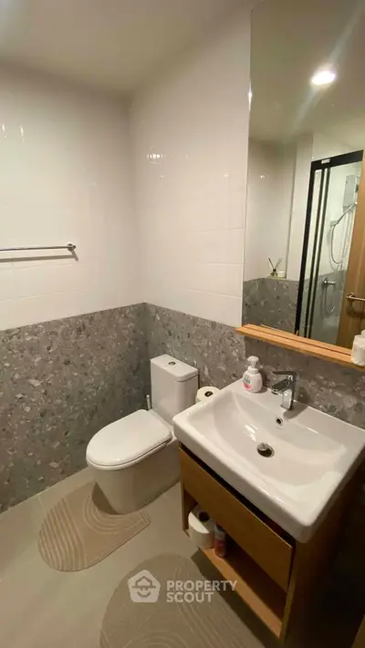 Modern bathroom with sleek fixtures and stylish tile design