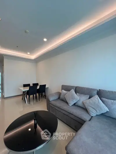 Modern living room with sleek furniture and ambient lighting