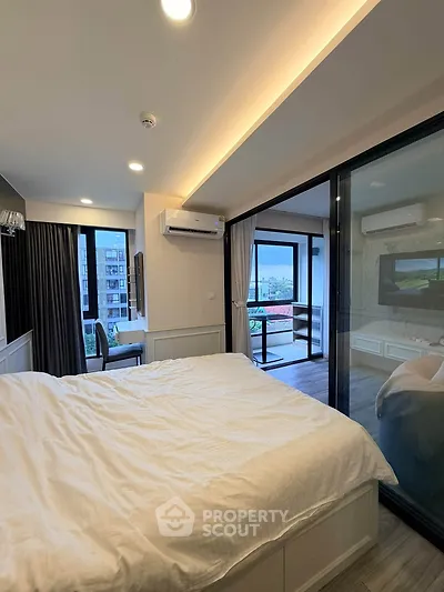 Modern bedroom with balcony view and stylish interior design