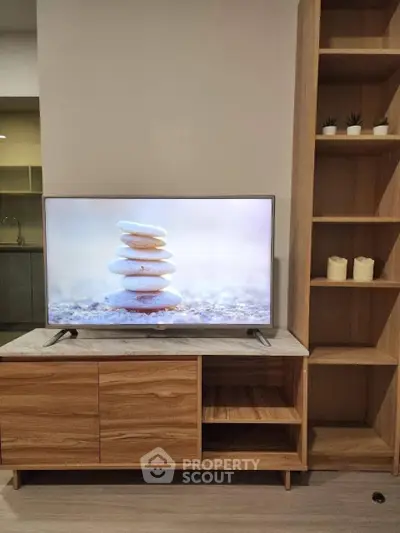 Modern living room with stylish wooden TV stand and shelving unit