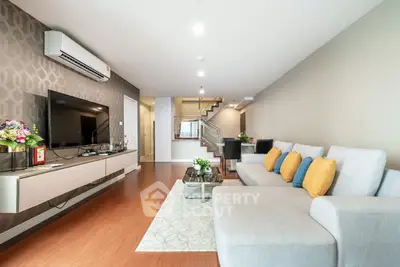 Spacious modern living room with stylish decor and comfortable seating