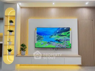 Modern living room with stylish TV setup and elegant lighting