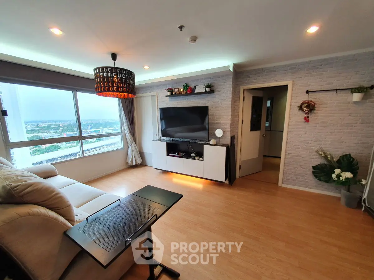 Modern living room with large window and stylish decor