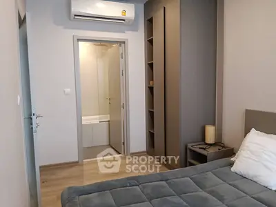 Modern bedroom with ensuite bathroom and air conditioning