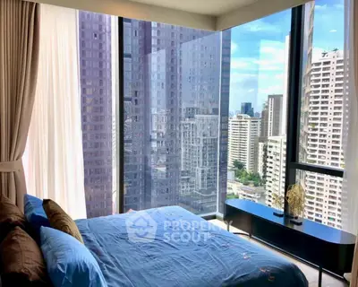 Luxurious bedroom with floor-to-ceiling windows offering stunning city views in a modern high-rise apartment.