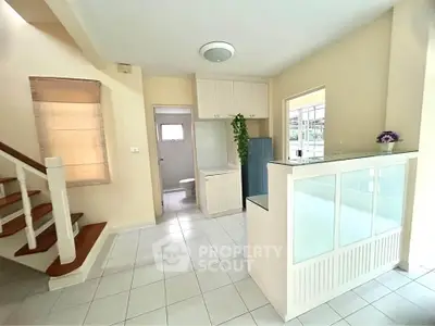 Spacious open-plan kitchen with modern design and ample natural light