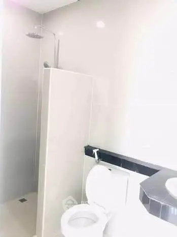 Modern bathroom with shower and toilet in sleek design