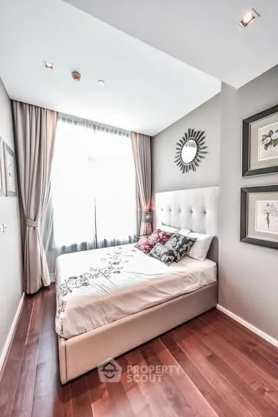 Elegant bedroom with plush bed and stylish decor in modern apartment