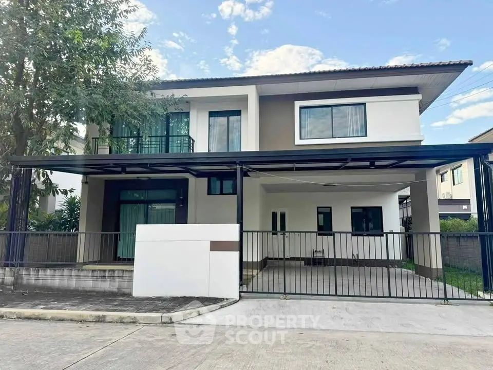 Modern two-story house with spacious driveway and sleek design