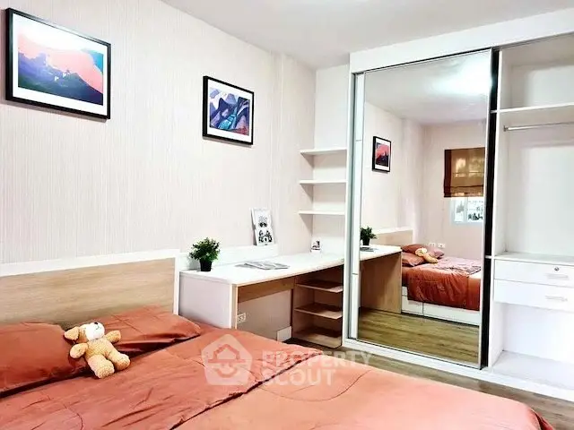 Cozy bedroom with mirrored wardrobe and stylish decor