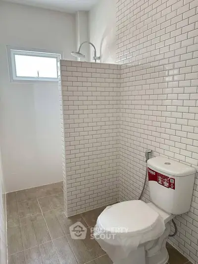 Modern bathroom with subway tiles and natural light