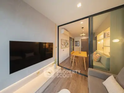 Modern living room with open layout and stylish decor in a contemporary apartment.