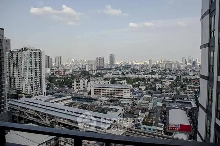 Stunning cityscape view from high-rise balcony showcasing urban skyline and architectural diversity.