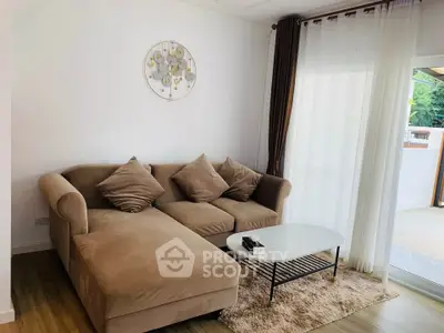 Cozy living room with plush sofa and elegant decor, perfect for relaxation.