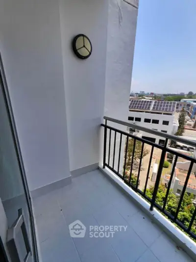 Charming balcony with city view, perfect for relaxation and enjoying the outdoors.