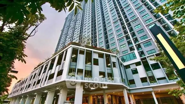 Stunning high-rise building with modern architecture and lush greenery