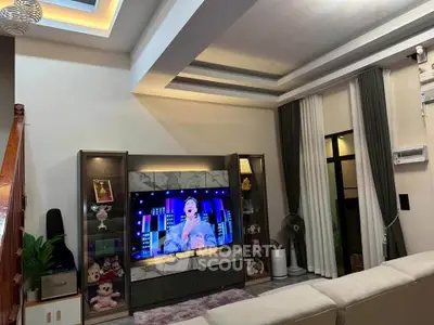 Modern living room with stylish ceiling design and entertainment center