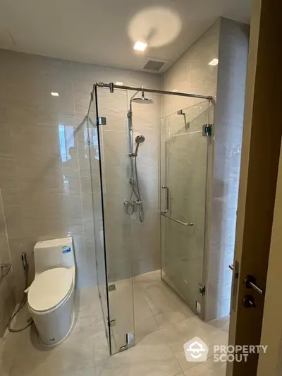 Modern bathroom with glass shower enclosure and sleek design