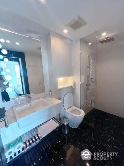 Luxurious modern bathroom with sleek fixtures and elegant marble finishes.