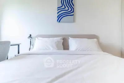 Modern bedroom with minimalist decor and stylish wall art