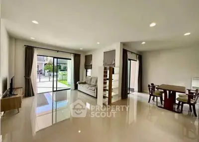 Spacious modern living room with open layout and large windows