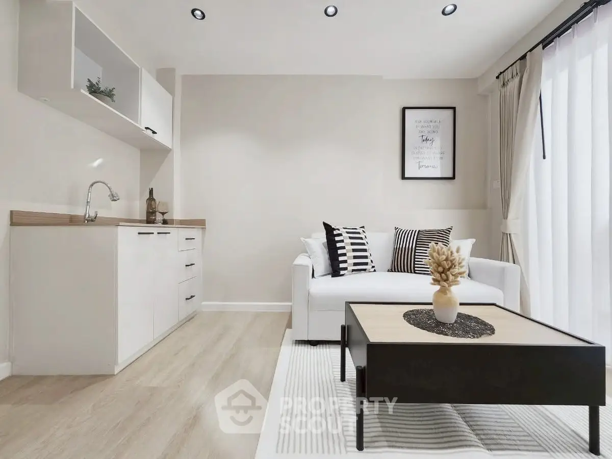 Modern living room with stylish decor and open kitchen layout