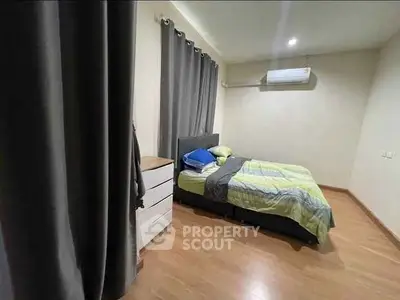 Cozy bedroom with modern decor and air conditioning