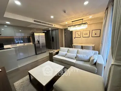 Luxurious open-plan living room with modern kitchen and elegant decor