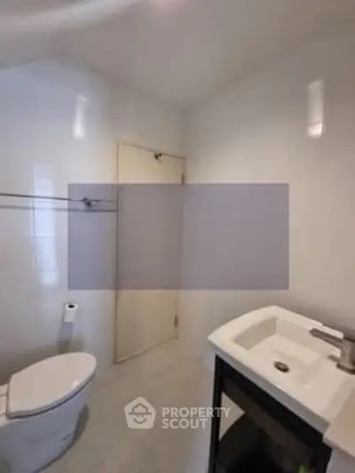 Modern bathroom with sleek fixtures and minimalist design.