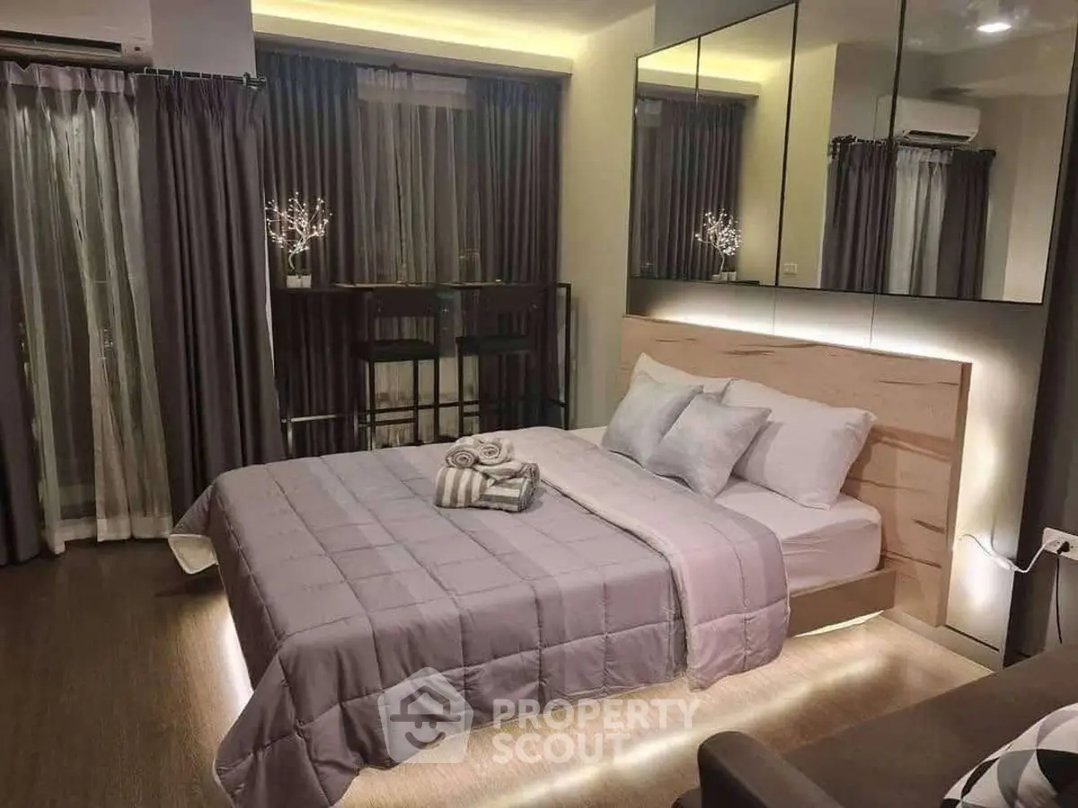Luxurious modern bedroom with elegant decor and ambient lighting