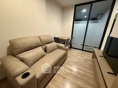 Cozy living room with beige sofa and modern decor