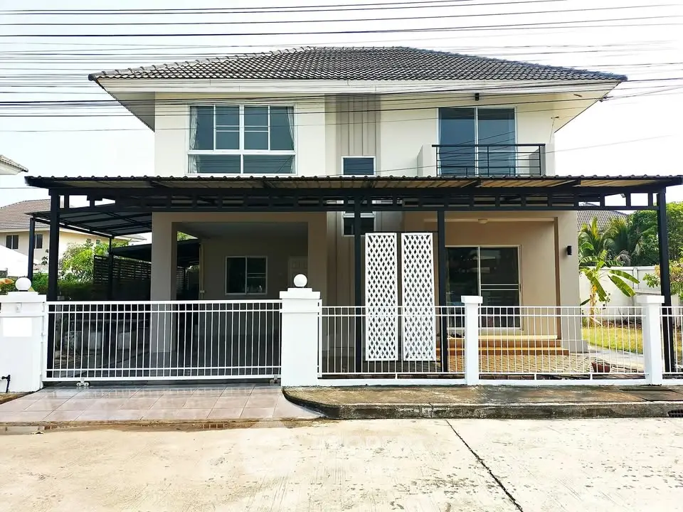 Modern two-story house with spacious driveway and stylish facade