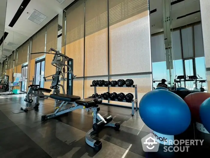 Modern gym with state-of-the-art equipment and bright natural lighting