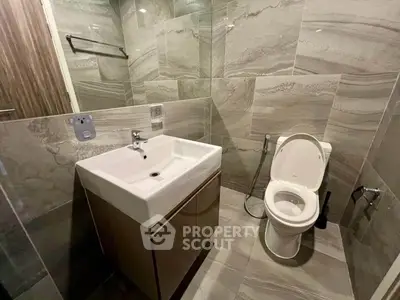 Modern bathroom with sleek tiles and contemporary fixtures