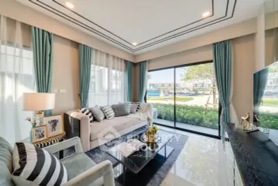 Luxurious living room with modern decor and large windows overlooking a serene garden view.