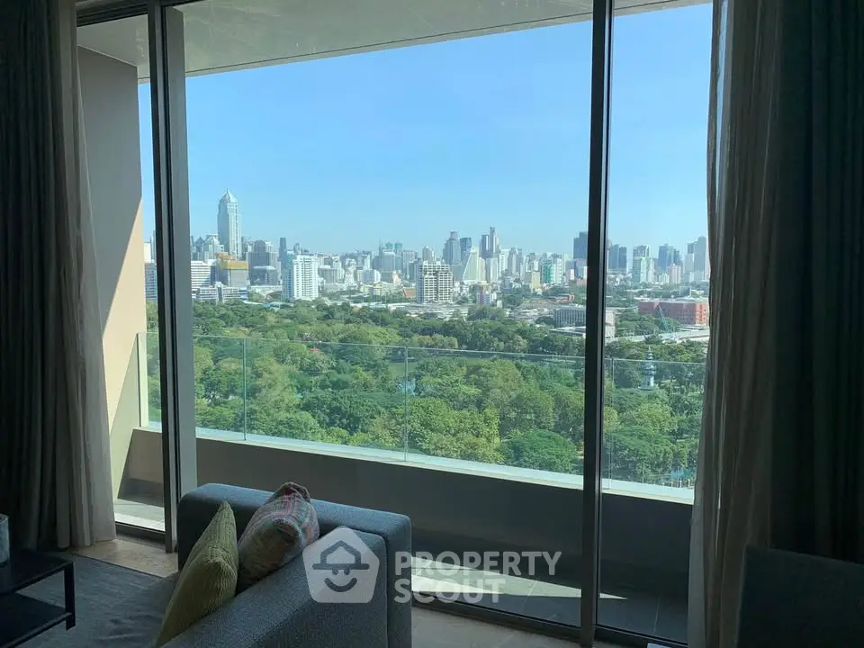 Stunning cityscape view from modern apartment balcony with lush greenery
