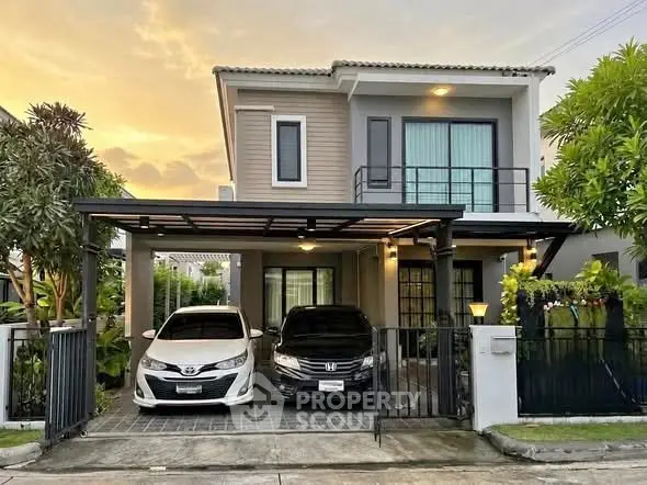 Charming two-story house with modern design and spacious driveway, perfect for family living.