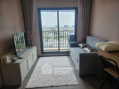 Modern living room with city view, cozy sofa, and sleek TV setup in a high-rise apartment.